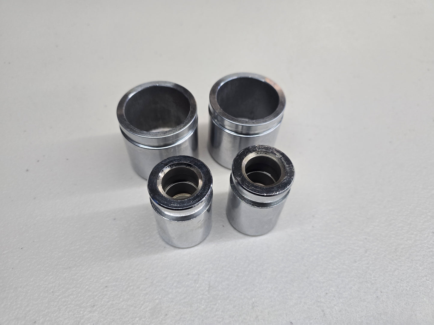 BMW E30 Brake Caliper Piston Set (Front & Rear)